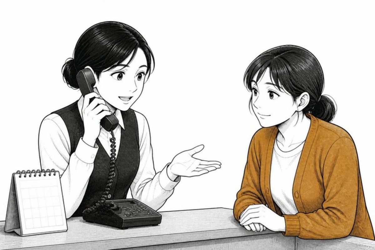 電話で貸主と話すスタッフ
